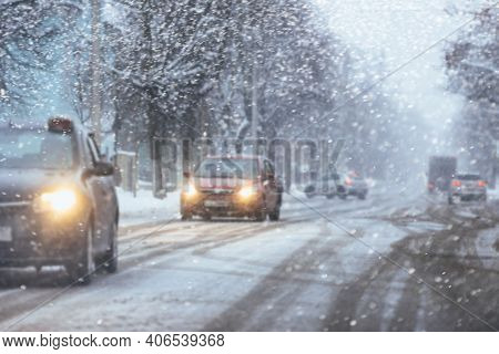 Car Driving On Snowy Urban Street.winter City