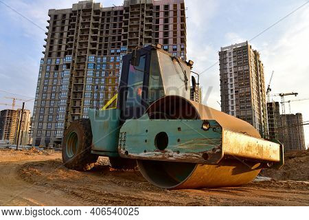 Vibro Roller Soil Compactor Leveling Ground At Construction Site. Vibration Single-cylinder Road Rol
