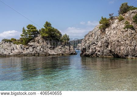 Big Rock In The Blue Waters Of Stafilos Beach, Skopelos, Skopelos Island, Greece.