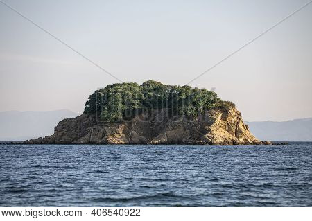 Big Rock In The Blue Waters Of Paralia Vasilias, Skiathos, Skiathos Island, Greece.