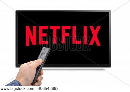 Usa, New York February 2, 2021: Close Up Of Nvidia Sheild Tv Remote In Hand And Tv Screen With Netfl