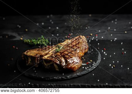 Barbecue Aged Wagyu Porterhouse Steak Sliced As Top View On A Slate Board, Beef T-bone Juicy Steak R