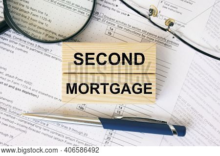 Wooden Blocks With Text Second Mortgage On Financial Docs