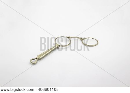 Old Vintage Lorgnette From The Middle Of The Nineteenth Century On The White Background