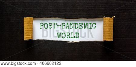 Post-pandemic World Symbol. The Words 'post-pandemic World' Appearing Behind Torn Black Paper. Beaut