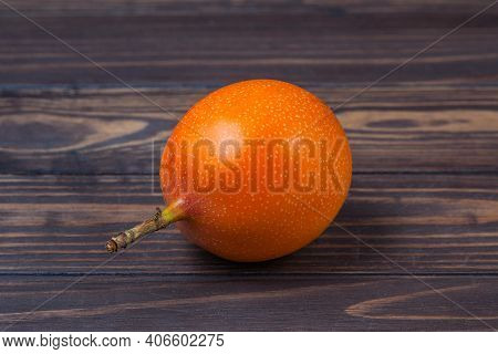 Ripe Grenadil Fruit, Lie On A Background Of Wooden Boards. High Quality Photo