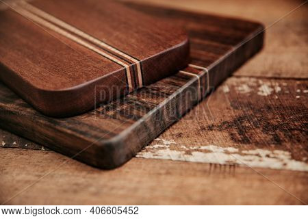 Set Of Wooden Cuttng Boads On Wooden Background. Wooden Kitchen Block Close Up.