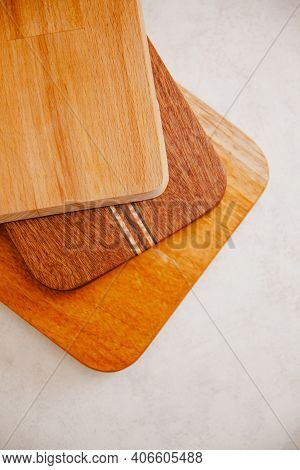 Set Of Wooden Cuttng Boads On White Background. Wooden Kitchen Block Close Up.