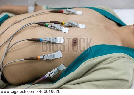 Heart Electrocardiogram Or Monitoring Using Holter For Young Patient. Male Athlete Does A Cardiac St