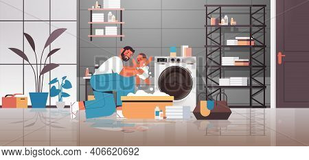 Young Father Bathing Little Son In Small Bath Tub Fatherhood Parenting Concept Dad Spending Time Wit