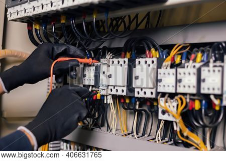 Electrician Engineer Work Tester Measuring Voltage And Current Of Power Electric Line In Electical C