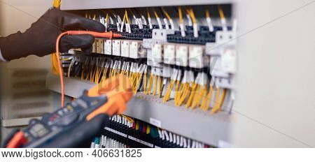 Electrician Engineer Work Tester Measuring Voltage And Current Of Power Electric Line In Electical C