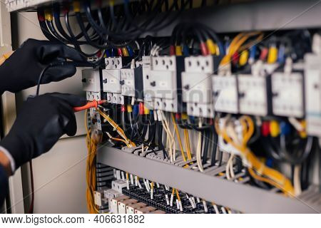 Electrician Engineer Work Tester Measuring Voltage And Current Of Power Electric Line In Electical C