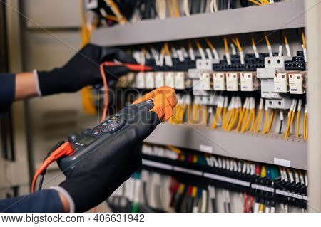 Electrician Engineer Work Tester Measuring Voltage And Current Of Power Electric Line In Electical C