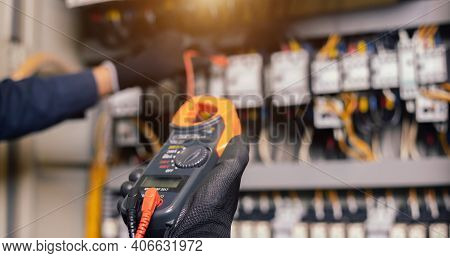 Electrician Engineer Work Tester Measuring Voltage And Current Of Power Electric Line In Electical C