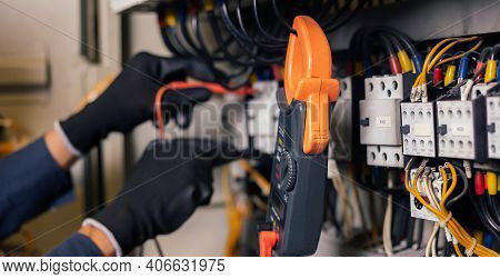 Electrician Engineer Work Tester Measuring Voltage And Current Of Power Electric Line In Electical C