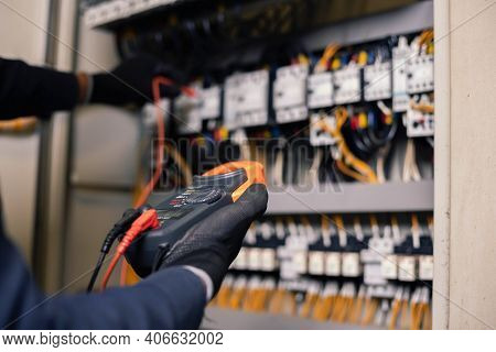 Electrician Engineer Work Tester Measuring Voltage And Current Of Power Electric Line In Electical C