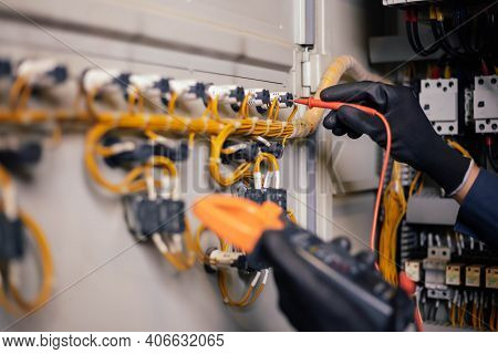 Electrician Engineer Work Tester Measuring Voltage And Current Of Power Electric Line In Electical C