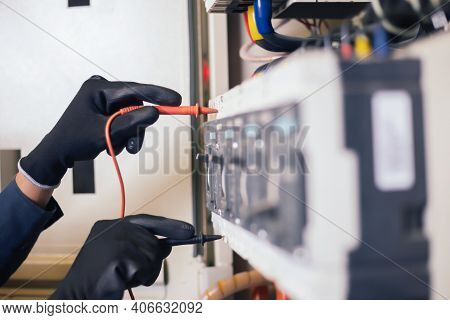 Electrician Engineer Work Tester Measuring Voltage And Current Of Power Electric Line In Electical C