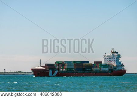 Portugal, Lisbon, October 08, 2018: Container Ship Sailing In To The Seaport.