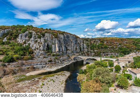 The Bridge Over The River Ardeche Near The Old Village Balazuc, Which Is Recognized As Historical He