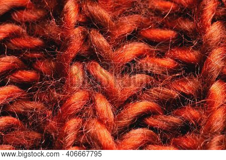 Close-up Of Knitted Cables In A Chunky Knit Red Sweater