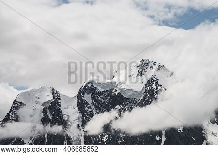 Atmospheric Minimalist Alpine Landscape With Massive Hanging Glacier On Snowy Mountain Peak. Big Bal