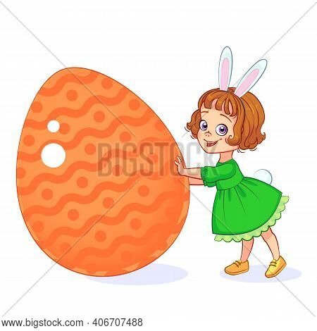 Beautiful Little Girl Dressed As The Easter Bunny With Rabbit Ears And Tail Pushes Large Painted Eas