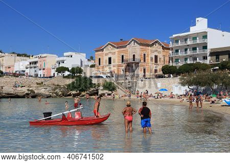 Apulia, Italy - May 30, 2017: People Visit Santa Maria Al Bagno Beach In Apulia, Italy. With 50.7 Mi