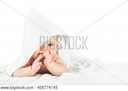 Close-up Child In White Towel Isolated On White Background. Bathing Babies And Restful Sleep. Funny 