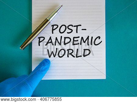 Post-pandemic World Symbol. Hand In Blue Glove With White Card. Concept Words 'post-pandemic World'.