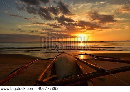 Filipino Fishing Boat At Sunset On The Sugar Beach, Fishing Boat On The Beautiful Sandy Coast Of The