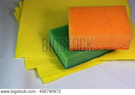Kitchen Sponges And Napkins Close Up. Cleaning Equipment And Products. Kitchen Multicolored Orange A