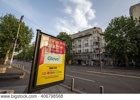 Belgrade, Serbia - May 14, 2019: Glovo Logo On An Ad Promoting In House Delivery From Idea Supermark