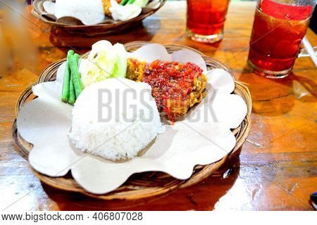 Geprek Chicken With White Rice Topped With Red Chili Sauce