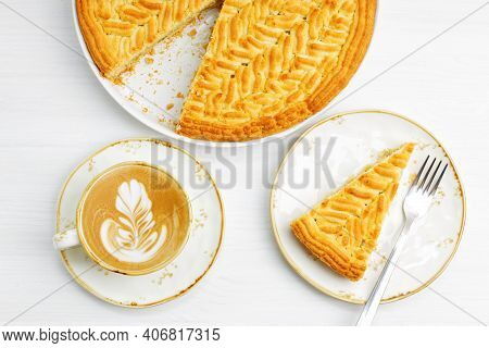 Homemade Gooseberry Lemon Pie And Cup Of Coffee Cappuccino On White Wooden Tabke. Top View.