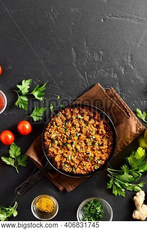 Keema Curry In Frying Pan Over Black Stone Background With Copy Space. Indian And Pakistani Style Di