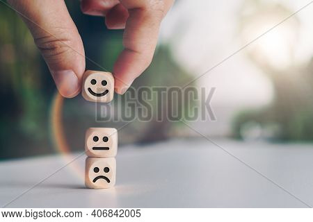 Smile Face And Cart Icon On Wood Cube. Optimistic Person Or People Feeling Inside And Service Rating