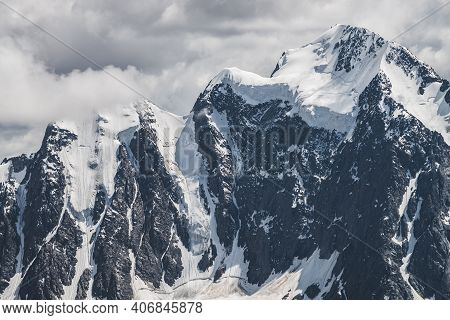 Atmospheric Minimalist Alpine Landscape With Massive Hanging Glacier On Snowy Mountain Peak. Big Bal