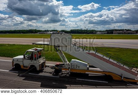 July 2, 2019, Moscow, Russia. Peron Transporter Tows The Ladder To The Plane At Vnukovo Internationa