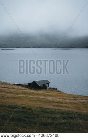 Bour Village Grass-covered Picturesque Houses At The Faroese Coastline In The Village Bour With View