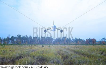 Passenger Plane Over A Forest And Field. Transport In Nature