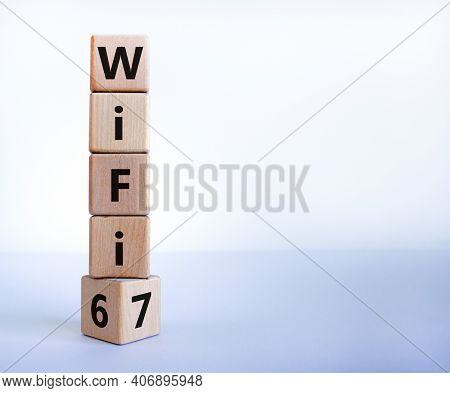 Wifi 6 Or 7 Symbol. Turned A Wooden Cube And Changed The Words Wifi 6 To Wifi 7. Beautiful White Bac