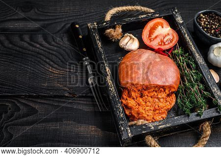 Mallorcan Sobrassada Cured Pork Meat Sausage In A Wooden Tray. Black Wooden Background. Top View. Co