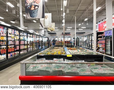 An Overview Of The Refridgerated Section Of A Bravo Market Grocery Store