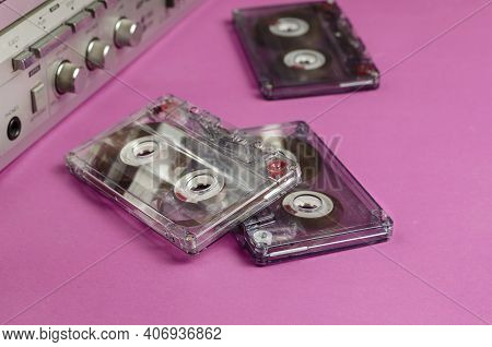 Boombox Stereo Radio Cassette Recorder And Random Cassettes On Pink Background. Vintage Cassette Dec