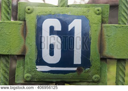 Weathered Grunge Square Metal Enameled Plate Of Number Of Street Address With Number 61