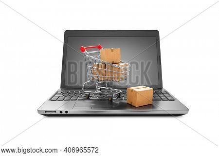 Ideas about online shopping, Cartons boxes in a shopping cart on a laptop keyboard on white background, including clipping path 