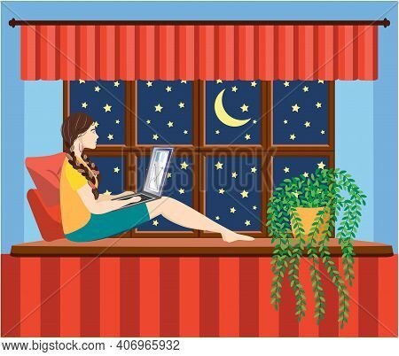 A Woman Works At A Laptop While Sitting On The Windowsill At Home. Freelance Concept, Quarantine Due