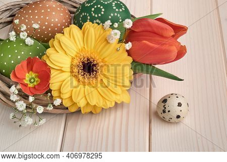 Happy Easter Springtime Decorations, Spring Flowers And Quail Egg. Orange Gerbera Daisy, Red Tulips,